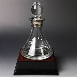 Silver mounted glass decanter, boxed with wooden plinth, together with a silver pepper grinder and a silver mounted Carrs desk clock, all hallmarked