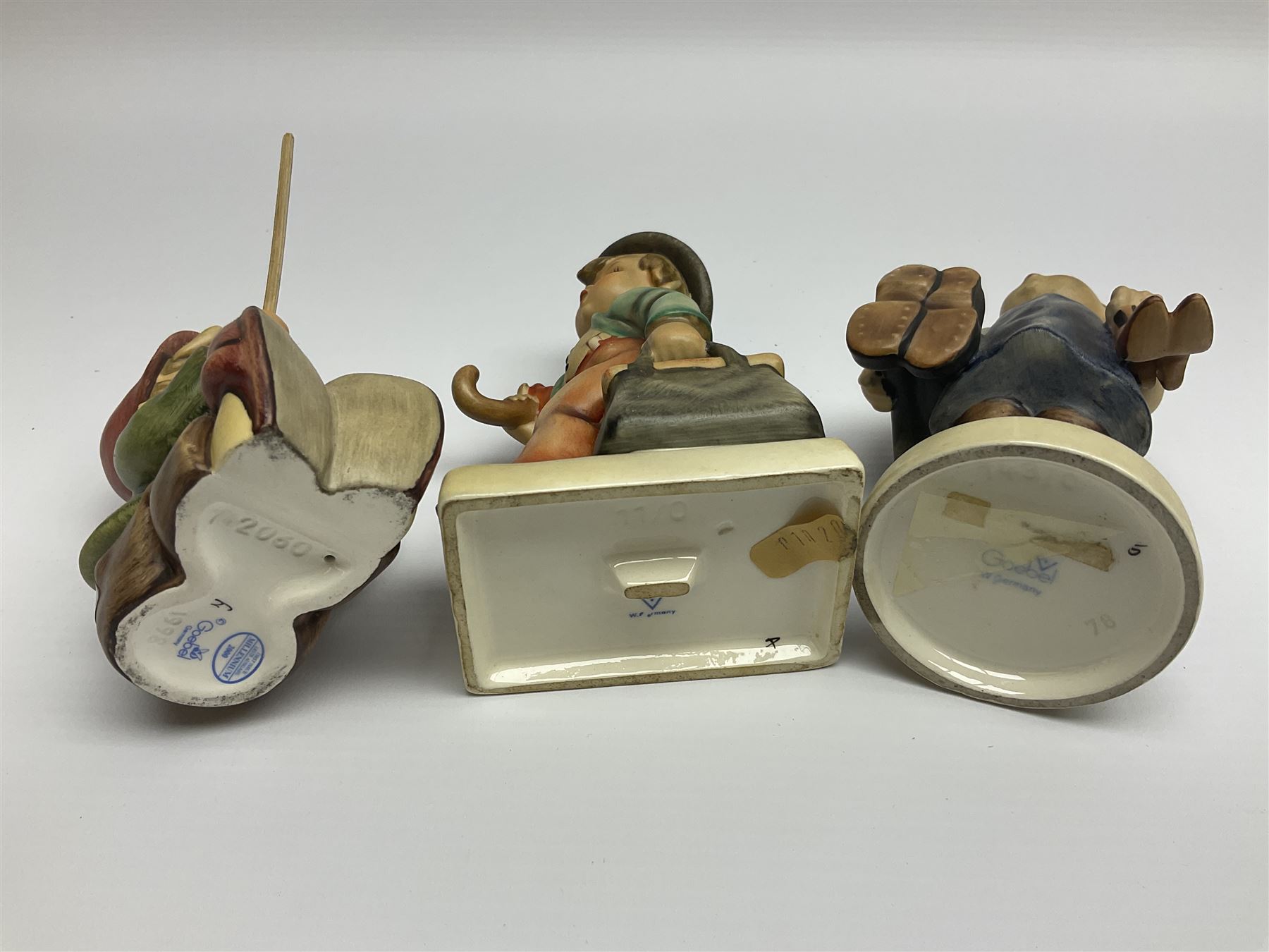 Thirty Hummel figures by Goebel, to include Saluting the Peacekeepers of Operation Joint Endeavor, on wooden plinth, Call to Glory, Celebrate with Song and Soldier Boy