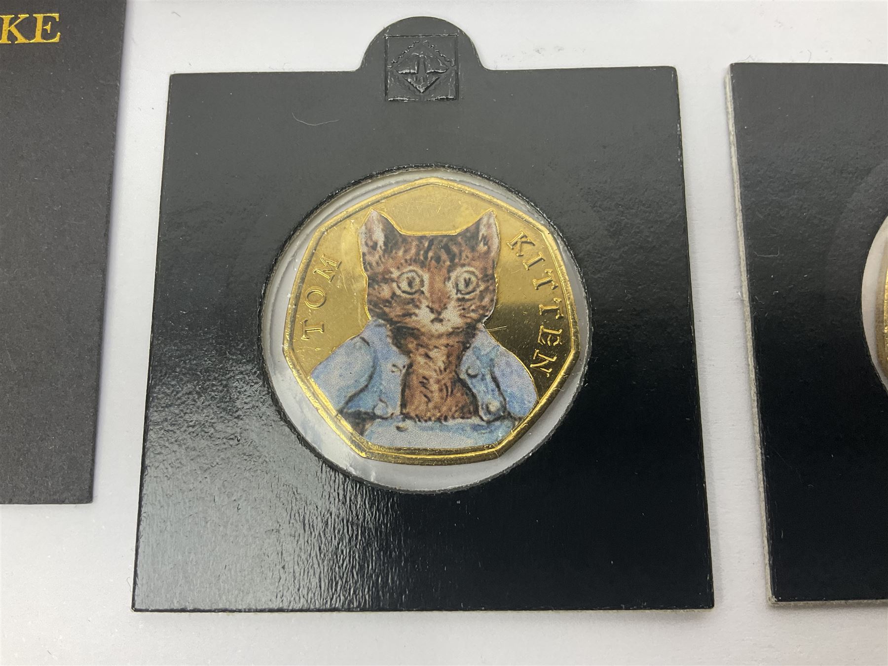 Four gold plated and coloured commemorative fifty pence coins, comprising 2017 Benjamin Bunny, Mr Jeremy Fisher, Tom Kitten and The Tale of Peter Rabbit, with Gold Strike certificate of authenticity