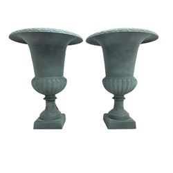 Pair of Victorian design teal painted cast iron campana shaped garden urns, egg and dart rim over a gadrooned underbelly, tapering column on square plinth base