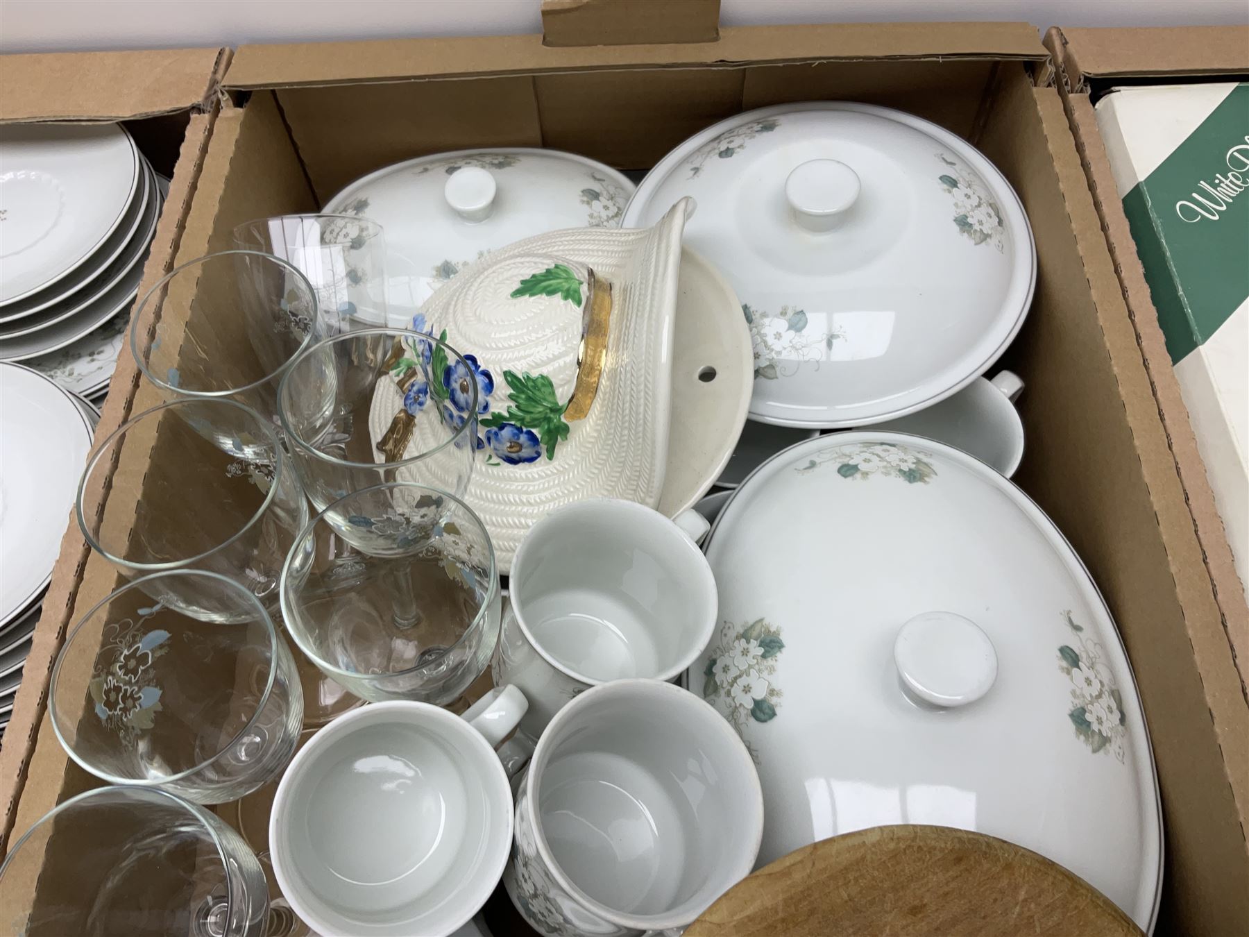 Large quantity of Porcelana Real Brasil White Blossom pattern tea and dinner wares, to include dinner plates, tea cups and saucers, salt and pepper pots, tureens, pie dishes coffee pots, place mats, spoons and glasses, etc, in five boxes 