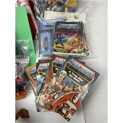 Thirty-one Masters of the Universe He-Man figures re-bagged on original backing cards;  two others lacking backing cards; boxed Modulok figure; bag of weapons and accessories; Roton, two horses and two battle cats; 1986 & 1987 Annuals; Ladybird and other story books; Panini sticker album; instructions etc