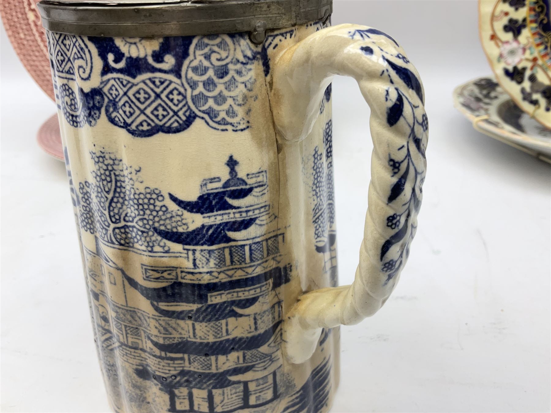 Four mid 19th century Mason's Ironstone plates decorated in the Chinese Antiquities pattern, the central circular panel decorated with footed vase with stylised motifs within a floral border, with gilt detail, pattern no. 1438, largest D26cm, together with Royal Worcester plate with floral decoration within green borders, blue and white tankard with pewter lid and teapot, teapot
