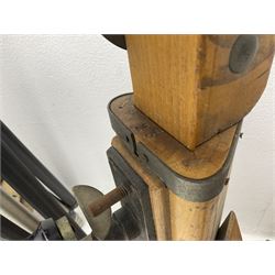 Three wooden adjustable tripods for plate cameras, together with a Linhof of Munchen metal tripod in a canvas case 