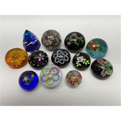 A group of paperweights, to include five with Millefiori type decoration, others with internal flower decoration, a Swarovski Crystal example, etc.