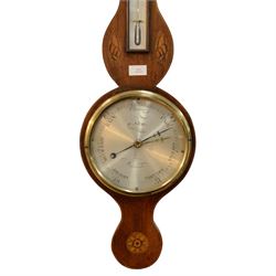 Early 19th century-Sheraton two instrument mercury barometer c1820, with a break arch top and round base, mahogany veneer with inlaid motifs and stringing to the edge, surface mounted mercury thermometer recording degrees Fahrenheit and an 8” silvered register with predictions and recording barometric air pressure from 28 to 31 inches, with a steel indicating hand and brass recording hand. Dial inscribed P. Nicho. 
Mercury present, syphon tube and pulleys intact.