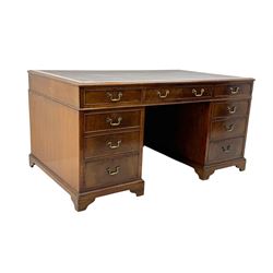 Edwardian mahogany twin pedestal desk, rectangular burgundy leather top moulded edge, over three short drawers with brass swan neck handles, over twin pedestals with graduating drawers supported on bracket feet