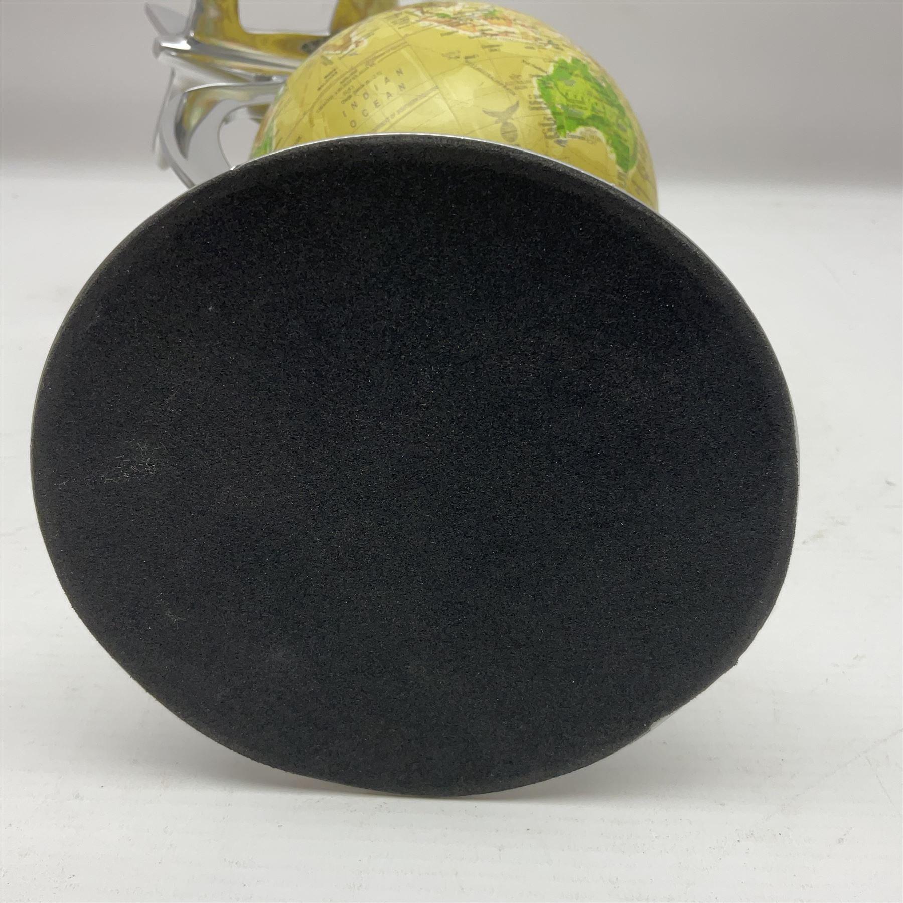 Art Deco style world globe with chrome aeroplane finial and mounts, H31cm