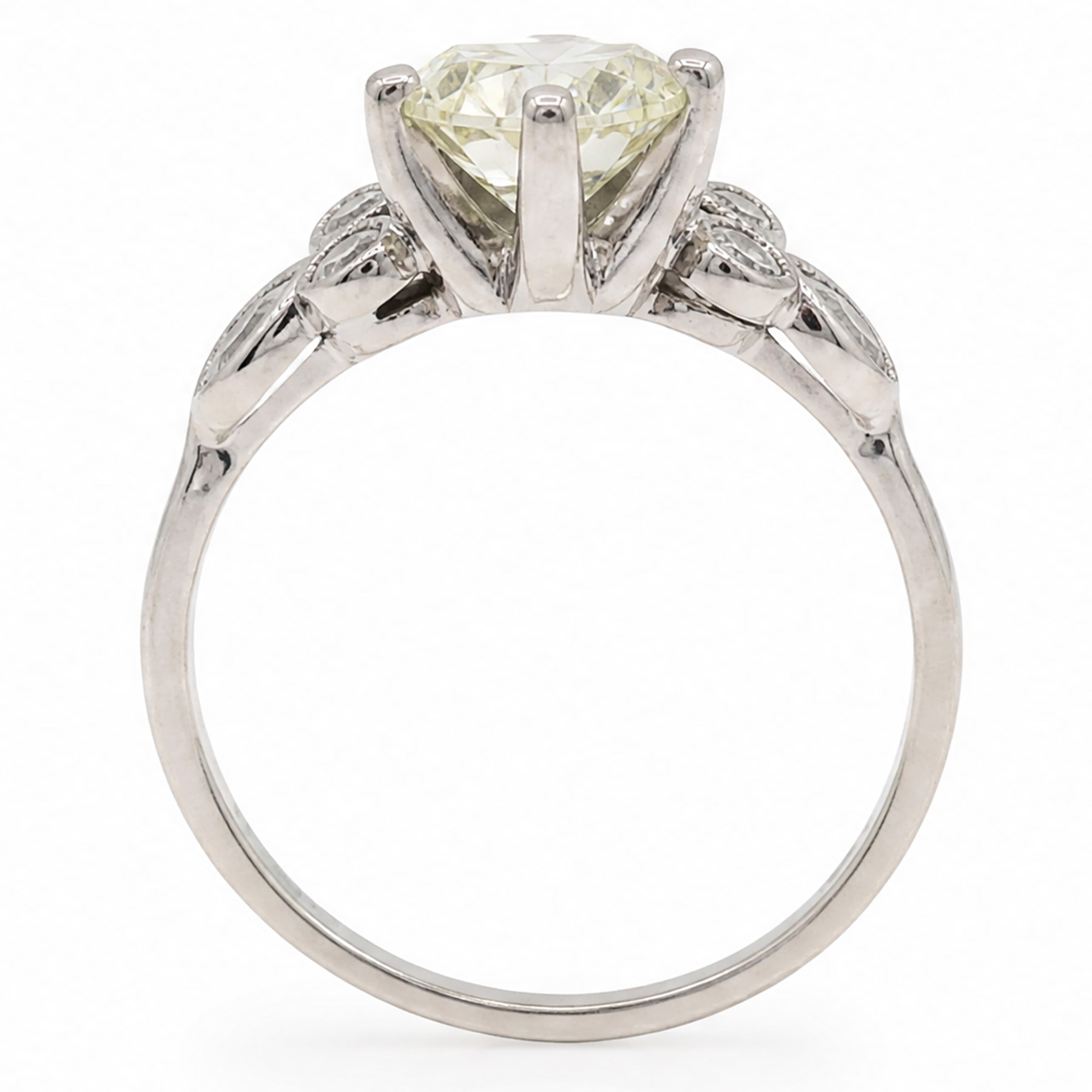 Platinum diamond ring, six claw set with a single old cut diamond of approx 1.35 carat, each shoulder milgrain set with two single cut diamonds and a marquise cut diamond, stamped Plat