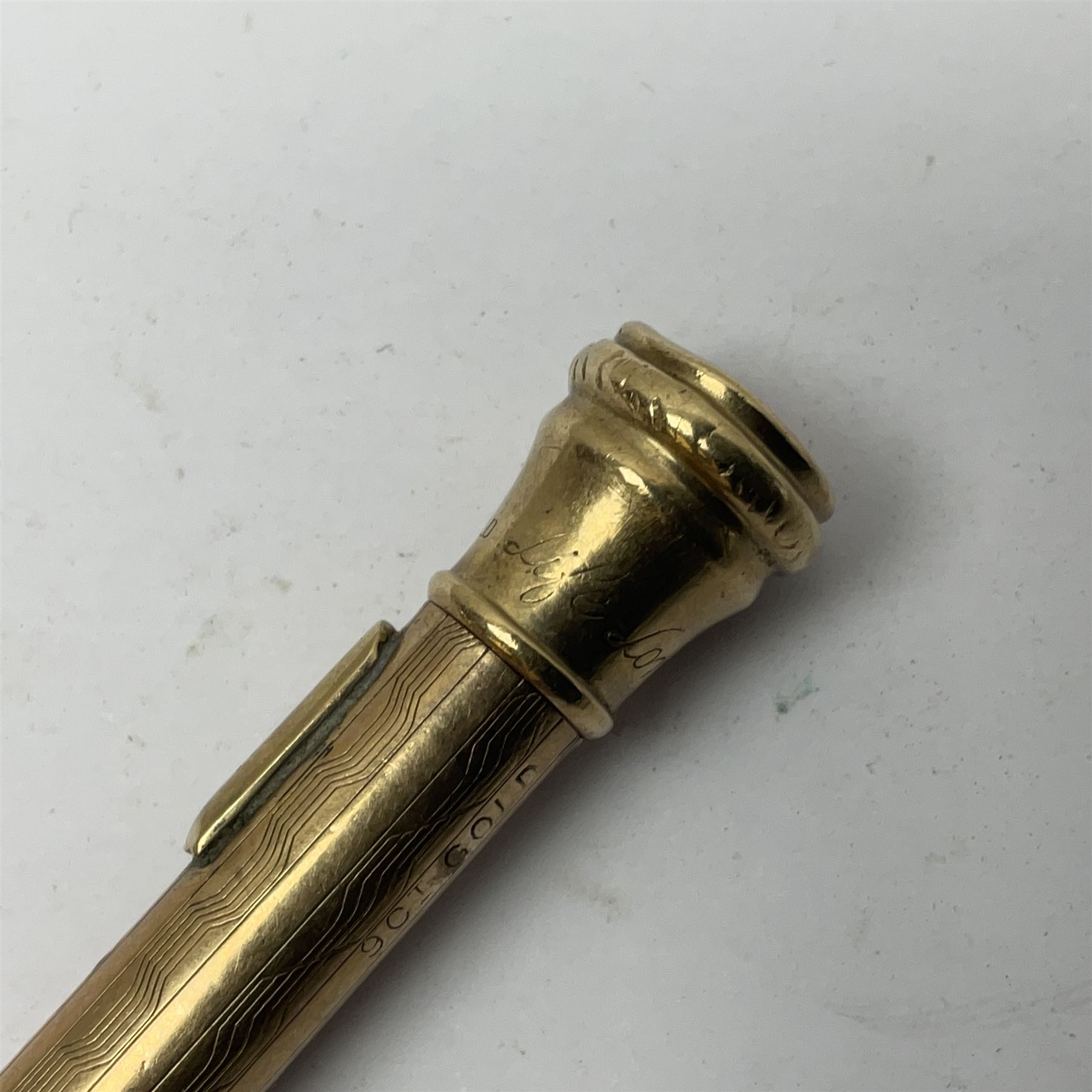 9ct gold 'Lifelong' propelling pencil, with engine turned decoration, stamped 9ct 