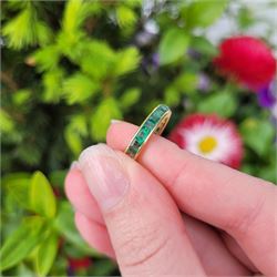 18ct gold emerald full eternity ring, channel set with calibre cut emeralds