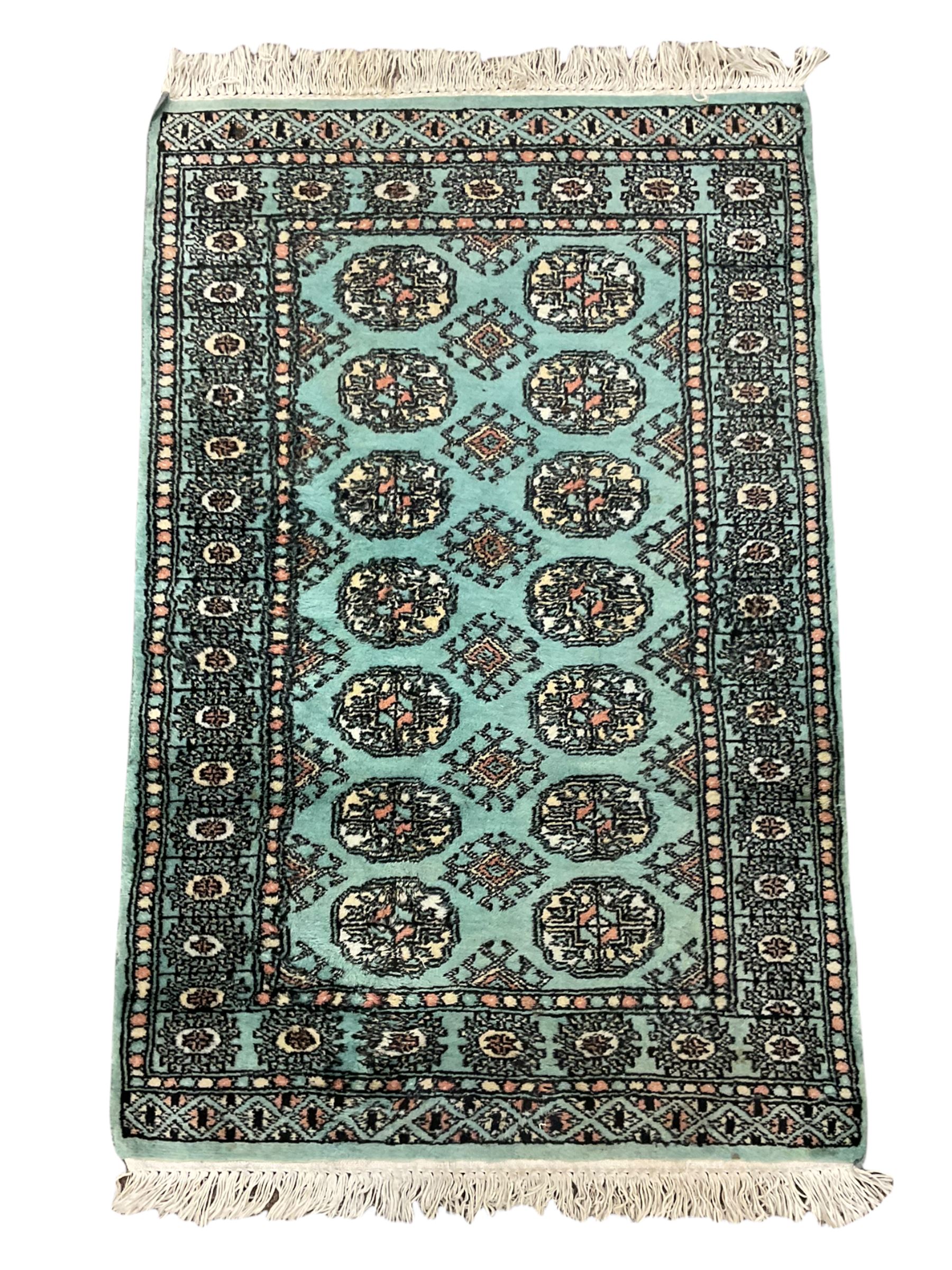 Small Bokhara green rug, Chinese hearth rug and two modern Persian design rugs