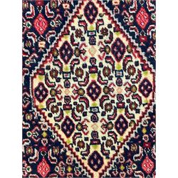 North West Persian Senneh indigo and crimson ground runner, the Herati decorated field with five interconnected lozenges, triple band border with repeating flower head motifs 