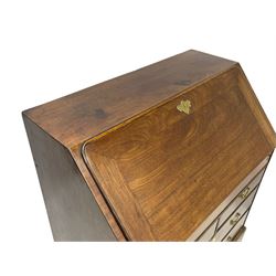 Georgian red walnut and mahogany bureau, moulded rectangular fall front with rounded upper corners, the interior fitted with sliding storage well, a combination of small drawers and pigeons holes, two short and two long drawers below, on bracket feet
