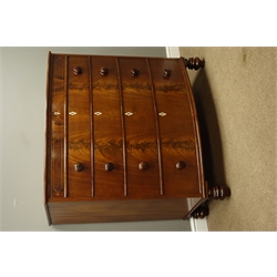  Early 19th Century figured mahogany bow front chest of four drawers, with rosewood faux frieze, turned handles and feet, W109cm, H112cm, D58cm  