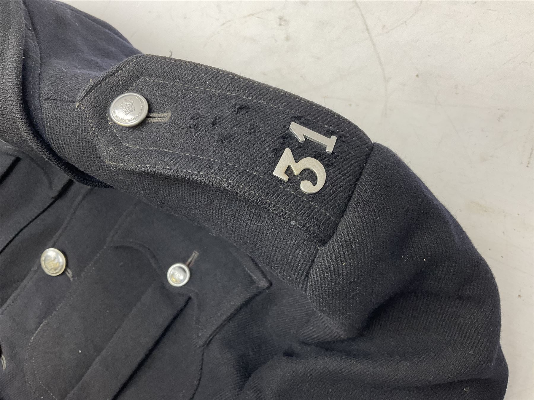 LNER Police cape; indistinctly dated 1943(?); York & North East Yorkshire Police belted tunic; belted tunic with Chief Constable epaulettes and buttons; and another tunic with staybrite Queens Crown buttons (4)