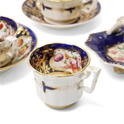 Collection of early 19th century Coalport pattern tea ware decorated with panels of flowers within a blue and gilt surround comprising eight tea cups, three coffee cups, eight saucers, four large plates, two handled sucrier and cover, milk jug and slop bowl and a similar small dish with loop handle