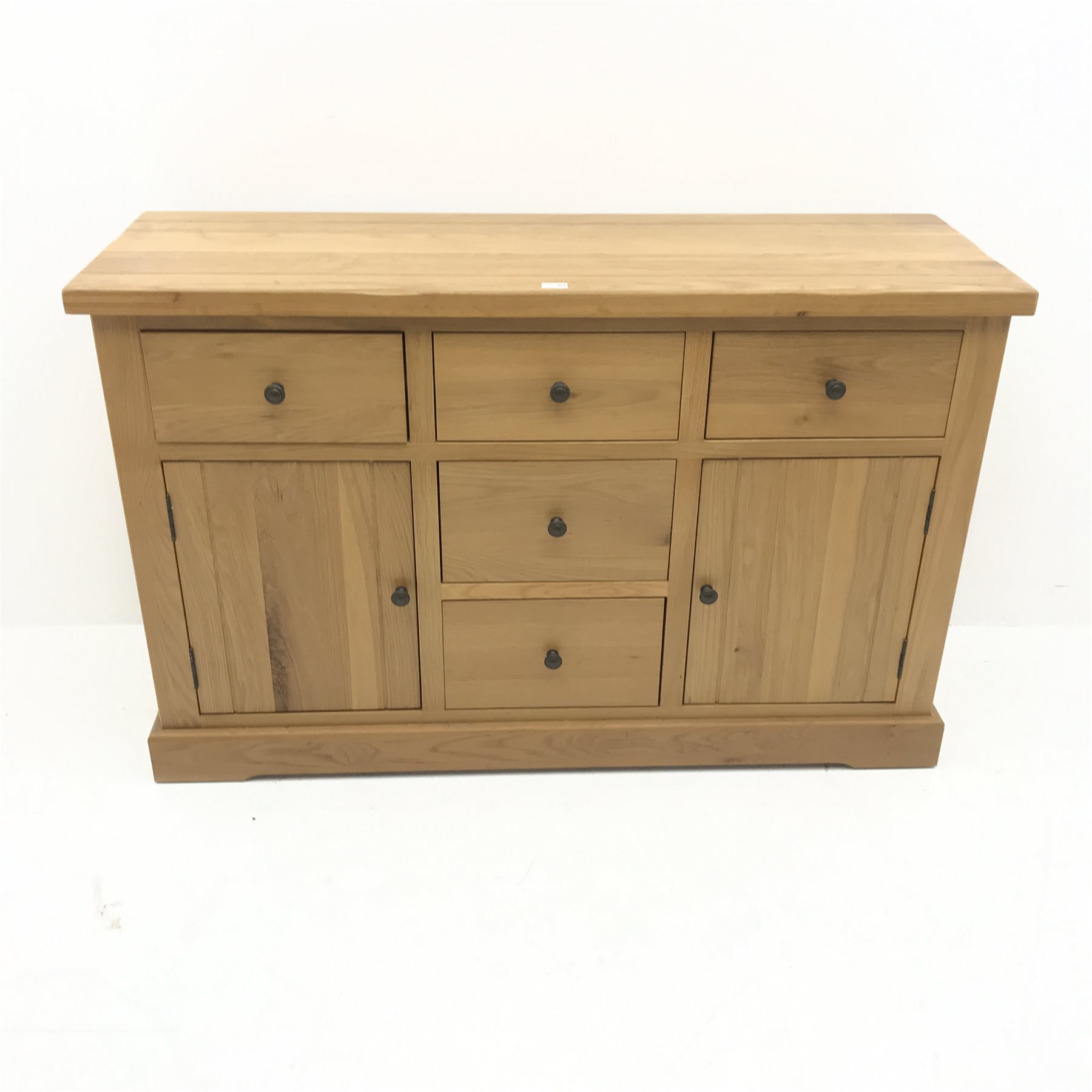 Light oak sideboard, five drawers, two cupboards, plinth base, W143cm