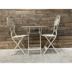 Cast metal bistro set including ornate oval garden table and two matching chairs