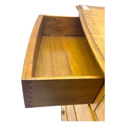 Frank Hudson - mid-20th century Mindi ash and burr walnut 'Spire' bow-fronted chest, featuring a crossbanded top over two short and three long cockbeaded drawers, raised on turned supports  