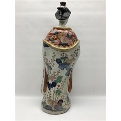 Large Japanese Imari porcelain figure, modelled as a Bijin, wearing a long kimono decorated with apple blossom and leafy branches on a white ground, with gilt detailing, possibly Edo period, H63cm