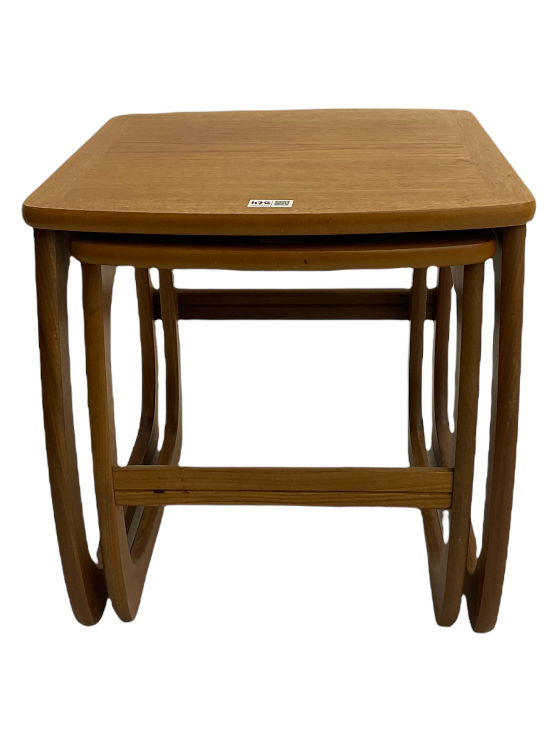 Nathan - teak Long John nest of tables and a singular nest of tables 