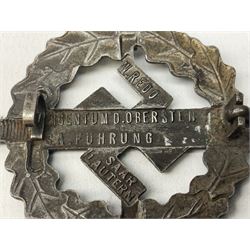 Two WW2 German Sports badges - SA sports badge marked verso 'W.Redo Eigentum D. Obersten SA. Fuhrung Saar Lautern'; and DRL sports badge marked verso 'Wernstein Jena D.R.G.M. 35269' (2)