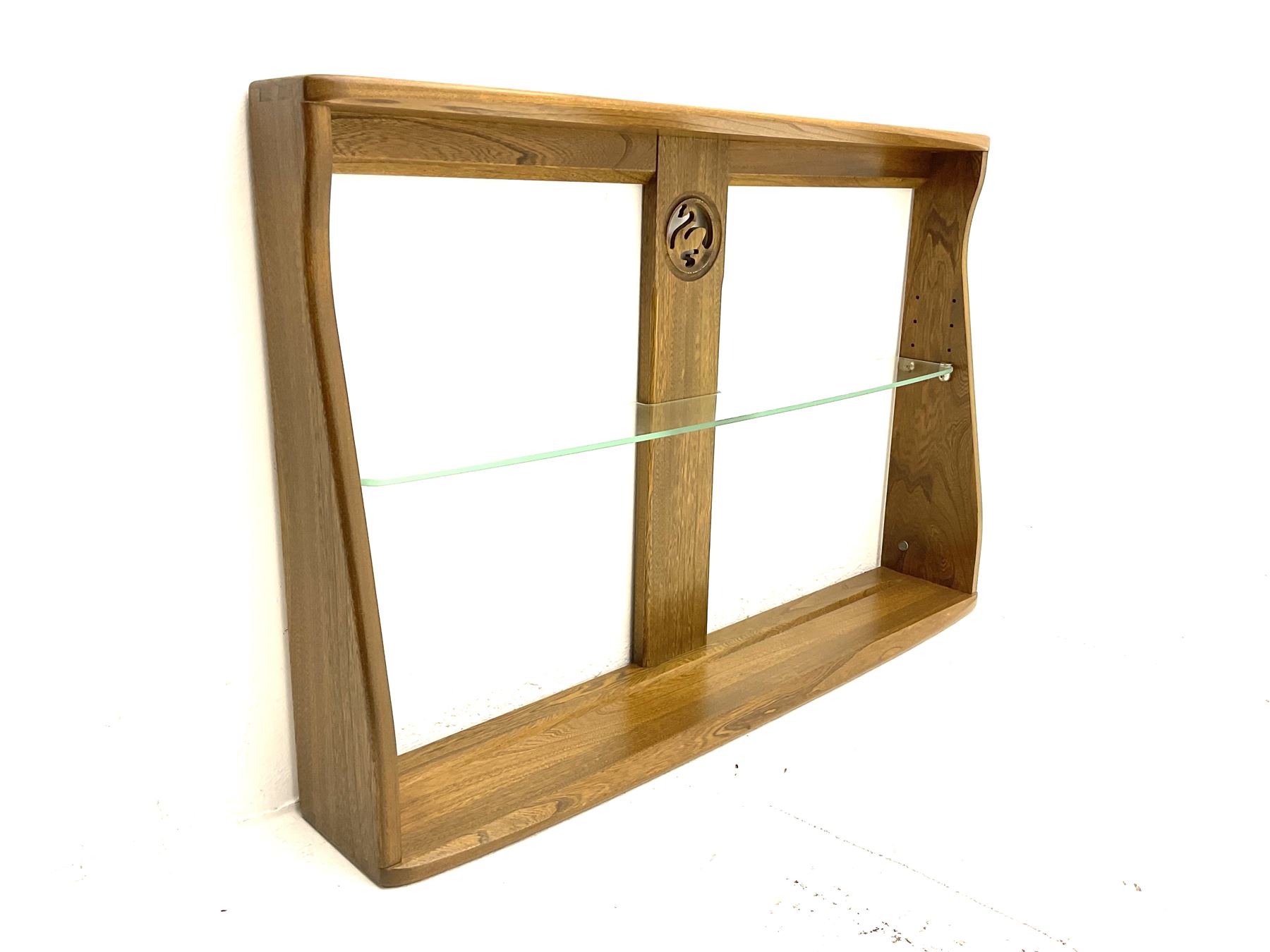 Ercol medium elm two tier wall plate rack, and additional Ercol two tier wall plate rack, with glass shelf and swan detail. 