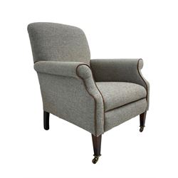 Interiors at Nine to Eleven - Edwardian design armchair, traditional shape with rolled arms, upholstered in 'Harris Tweed' fabric with leather piping, raised on square taping supports with castors