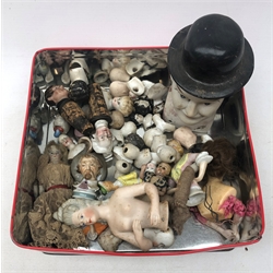  A selection of Victorian and later pin headed dolls, to include a number of bisque examples.   