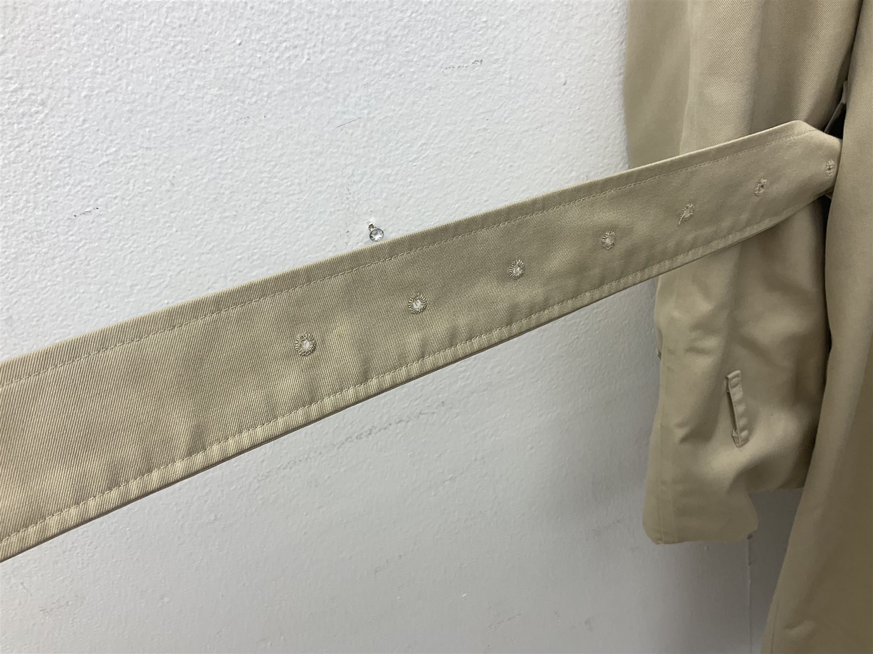 Ladies Burberry double breasted trench coat, with belt and detachable woollen gilet, in traditional cream colour with Burberry check lining, together with a gentlemans Burberry single breasted trench coat, both L112cm