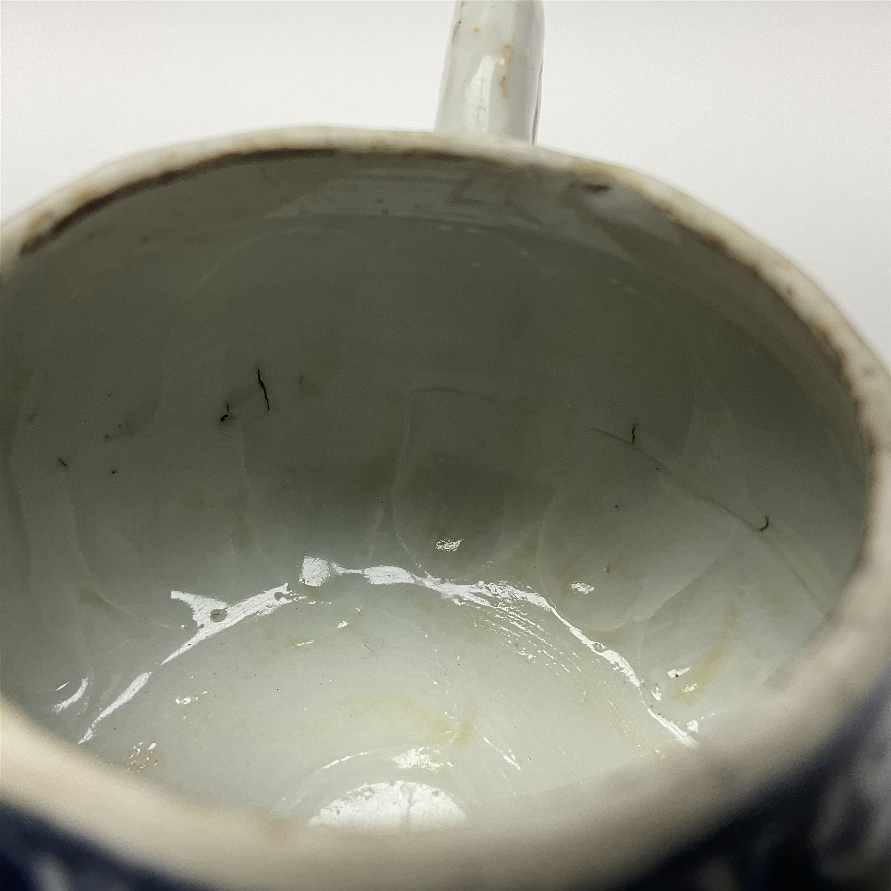 18th century Chinese blue and white teapot, painted with floral sprays, with lobed body and cover, H11cm