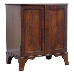 Regency ebony strung mahogany medal or coin collectors cabinet, with reeded top, two panel doors enclosing eleven drawers, shaped out splayed bracket feet