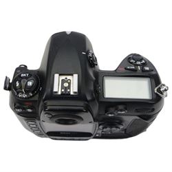 Nikon D2x digital SLR camera body, serial no. 5020627, with some associated battery packs and accessories