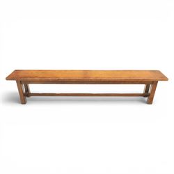 Country pine draw leaf table, bench seat and six chapel chairs, the top of plank construction, with two frieze drawers, additional leaves extending to 320cm, with bench seat and six elm chapel seats