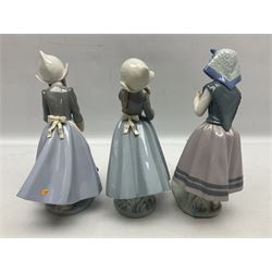 Three Lladro figures, comprising Dutch Girl with Braids no 5063, Dutch Girl with Duck no 5066 and Aracely with Ducks, all with original boxes, largest example H25cm