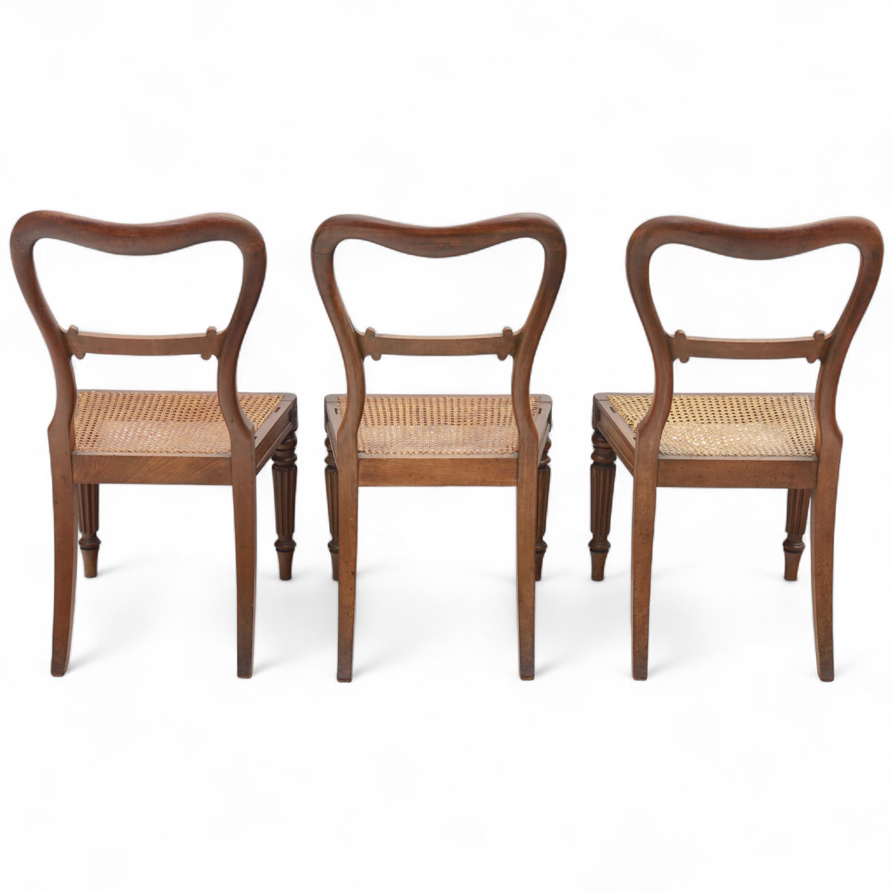 Gillows - Set of six mahogany dining chairs, each with curved top rail carved with floral medallion and scroll detail, fluted front supports, caned seats, the seat rail underside stamped HH identified as H. Howse an apprentice cabinetmaker at Gillows.