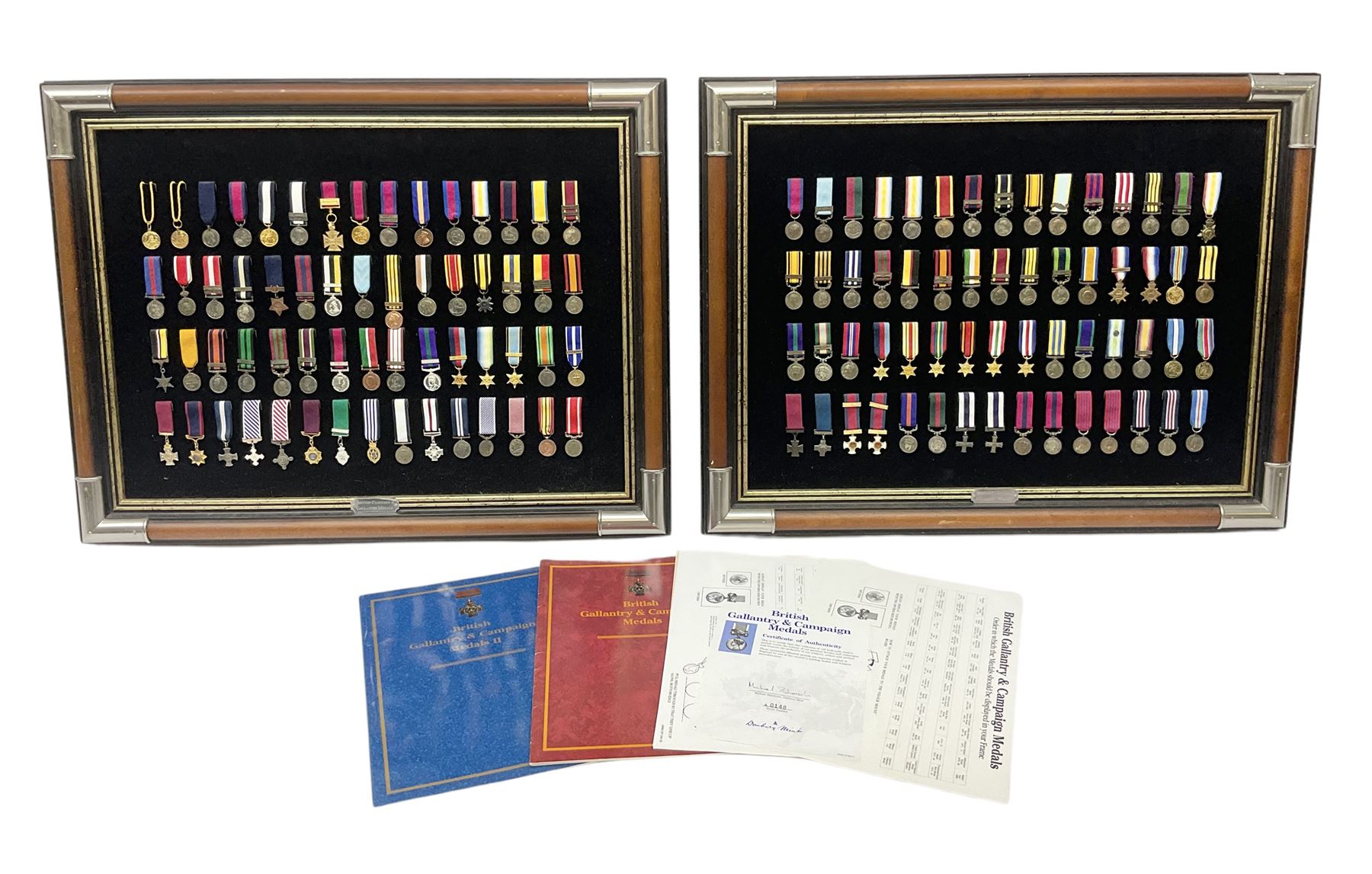 Two limited edition large framed display boards with half-size copies of British Gallantry and Campaign Medals produced by Danbury Mint and entitled 'For Valour'. Sixty medals on each board, all with ribbons. Complete with Danbury Mint certificate serial number A0148 and other paperwork.