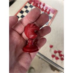 19th century walnut and brass bound games compendium box, painted to enhance the grain, of rectangular form, the hinged opening cover with rounded sides, central brass cartouche with engraved lion crest, and brass riveted straps, opening to reveal a red leather and blue silk lined compartmented interior, with fold-down games board, and lift-out tray containing playing cards, ebony turned dice towers, white and red stained bone draughts, and chess pieces, ivory dice, and ivory and ebony whist markers, and brass bezique board, cribbage board and markers, H15cm W32cm D24cm
This lot has been registered for sale under Section 10 of the APHA Ivory Act
