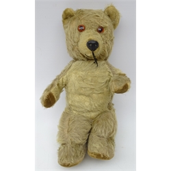  1950's Chiltern jointed musical clockwork teddy bear, golden mohair body, plastic nose and stitched mouth and swivel head, L33cm   