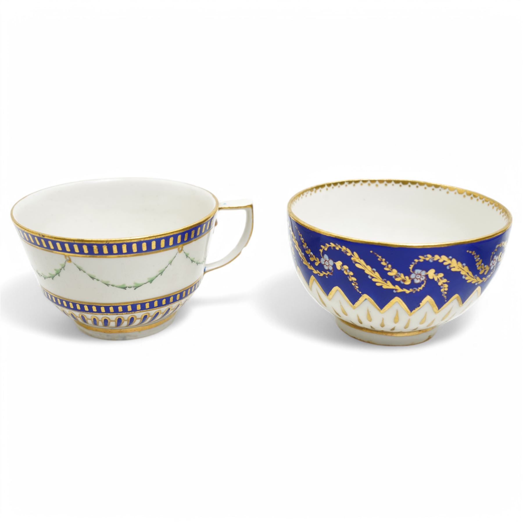 Two sets of Derby tea wares, comprising two saucers, teacup and small bowl, decorated in blue and white, with teardrop and swag motifs, heightened with gilt, one set marked pattern no. 34,  with late 18th century D mark in puce, the other with crown, D mark and crossed batons in puce (4)