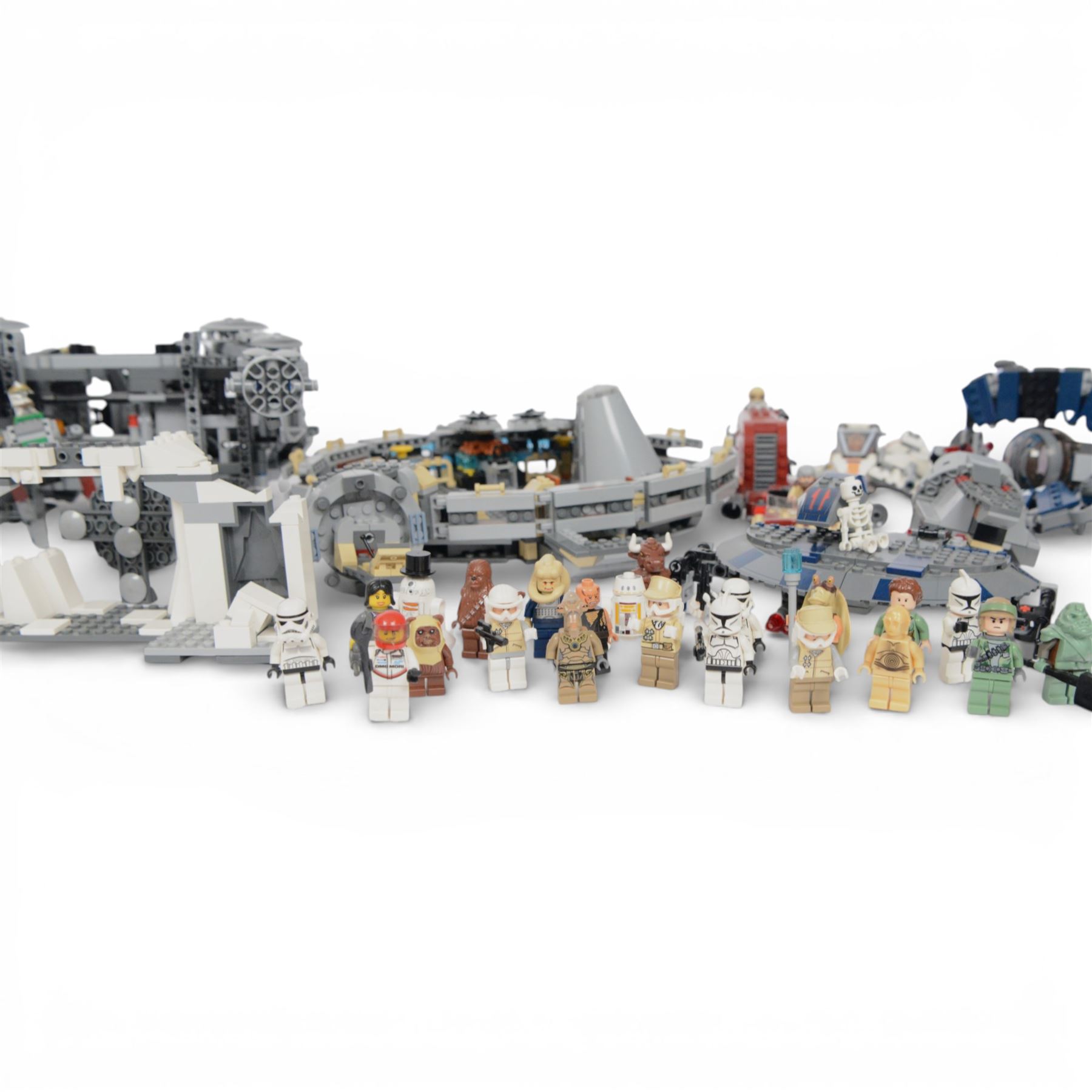 Collection of partially built Lego Star Wars models, including Motorized Walking AT-AT no. 10178, Hyena Droid Bomber no.8016, Emperor Palpatines Shuttle no. 8096, Jabbas Palace no. 4480 and Millennium Falcon no. 4504, etc together with a quantity of Lego Star Wars minifigures, loose parts and instruction booklets for Lego Star Wars sets