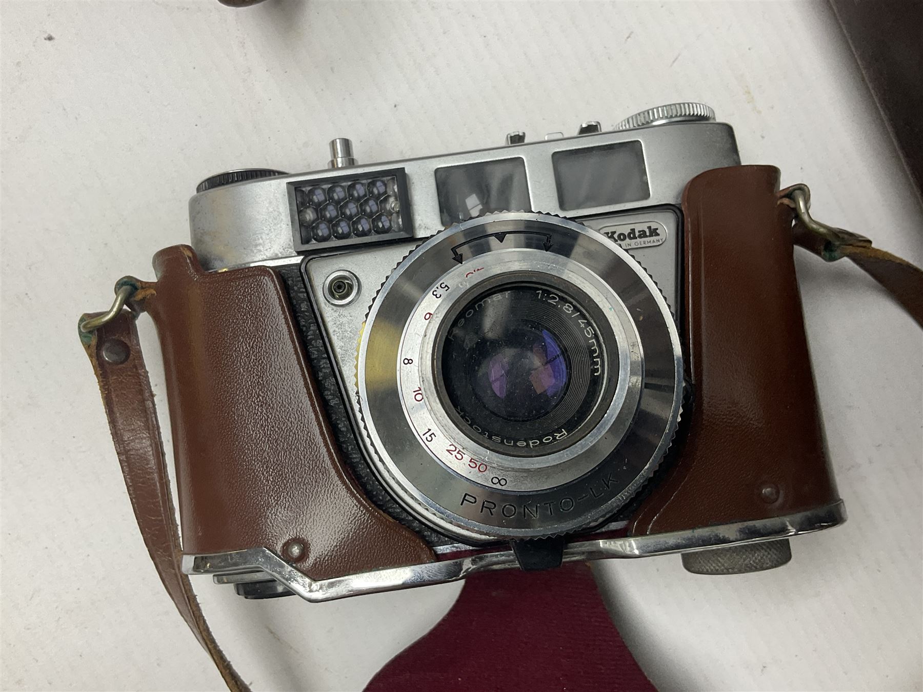 Collection of cameras and lenses, to include Pentax Program A camera body, serial no 123759, with 'Pentax-A zoom 1:3.5-4.5 28-80mm' len, Praktica EE2 camera body with 'Pentacon electric 1.8/50' lens etc, together with a Manfrotto tripod 