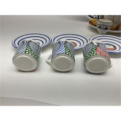 Modern studio pottery by Josie Firmin, to include cup and saucer, three espresso cups and saucers, pair of egg cups etc, each hand painted with varying cartoon cat designs