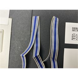 WWII set of three German Mother's Crosses, 1st Class in gilt, 2nd Class in silver and 3rd Class in bronze; all with ribbons (3)