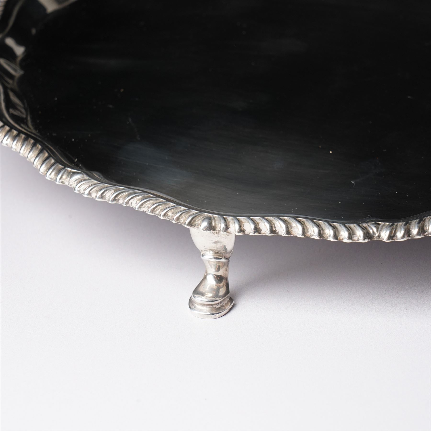 Silver circular salver with gadrooned border on shaped supports D25cm London 1968 Maker Edward Barnard & Sons Ltd