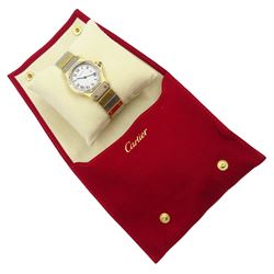 Cartier Santos ladies 18ct white and yellow gold automatic wristwatch, hexagonal case, white dial with date aperture and sapphire crown, on 18ct gold bracelet, hallmarked, with gold-over clasp, with red pouch