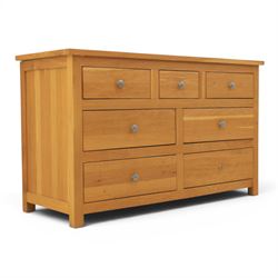 Solid oak chest of drawers, three over four drawers with metal pulls 