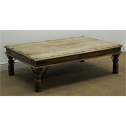  Rectangular eastern hardwood coffee table, moulded top, metal  studs and strap work corners, turned supports, 134cm x 91cm, H40cm  