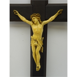  19th century continental carved ivory Corpus Christi, on later ebonised crucifix, the reverse inscribed E. Traissard.. Paris, H41cm x W20cm   
